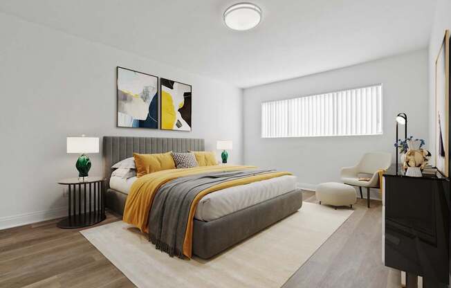 A modern bedroom with a large bed and a painting on the wall.