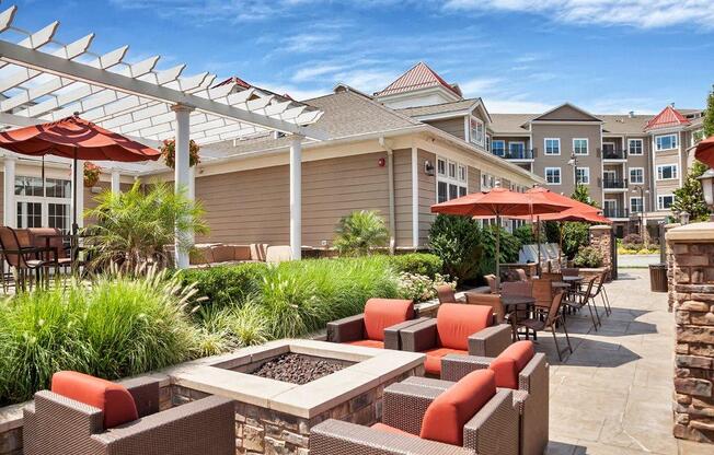 A patio with a table and chairs under a white awning at Vermella Lyndhurst apartments, Lyndhurst, NJ, 07071