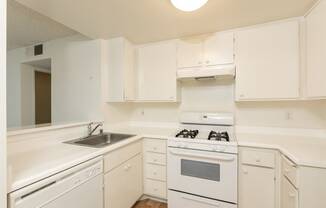 Kitchen with White Appliances and White Cabinets