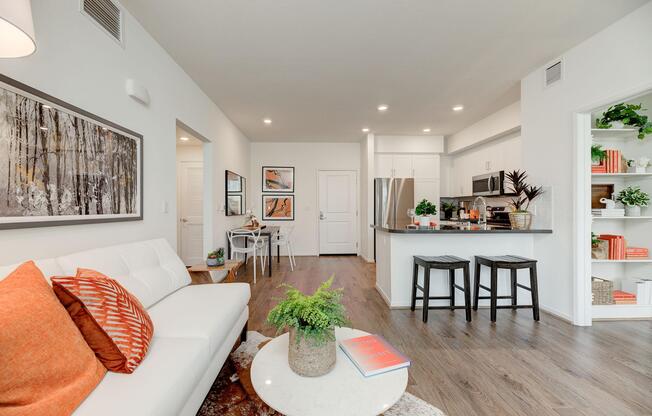 a living room filled with furniture and a flat screen tv