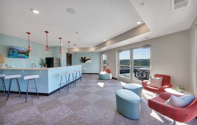A modern living room with a bar area and comfortable seating.