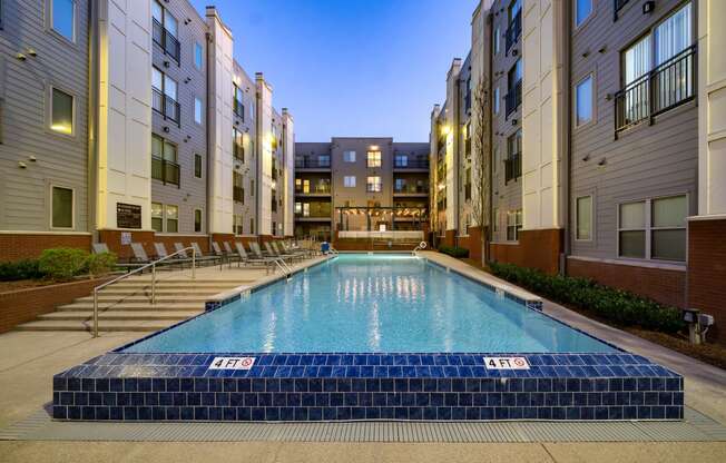 a swimming pool in the middle of an apartment building