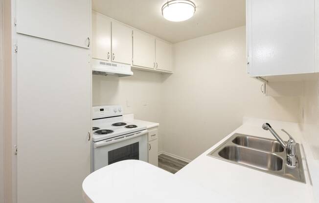 Kitchen with White Appliances and White Cabinets