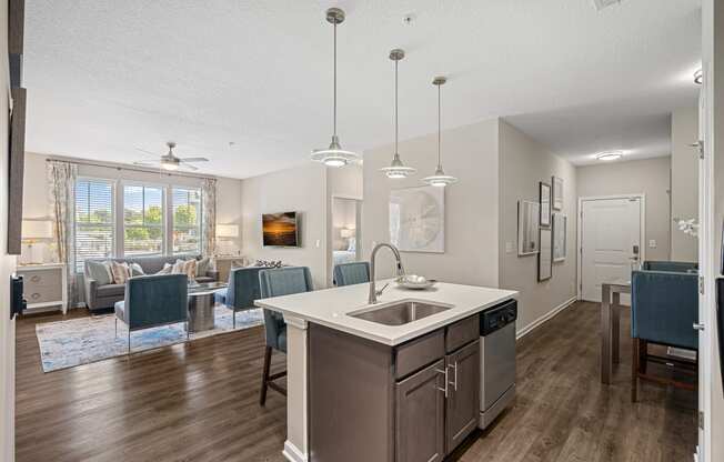 the preserve at ballantyne commons living room and kitchen with island and dining area