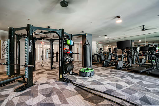 the gym at the has weights machines and other workout equipment