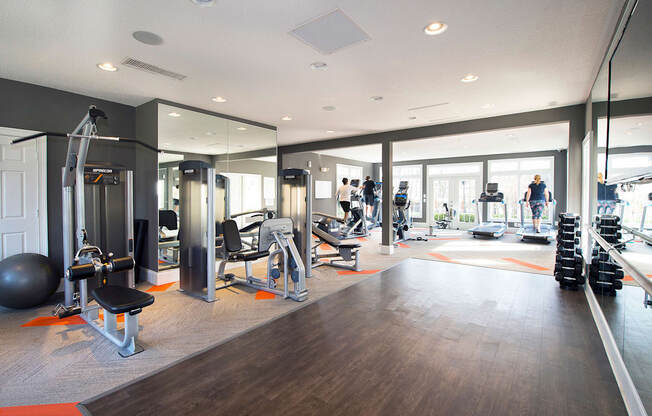 Fitness center with cardio machines, weight stations and free weights