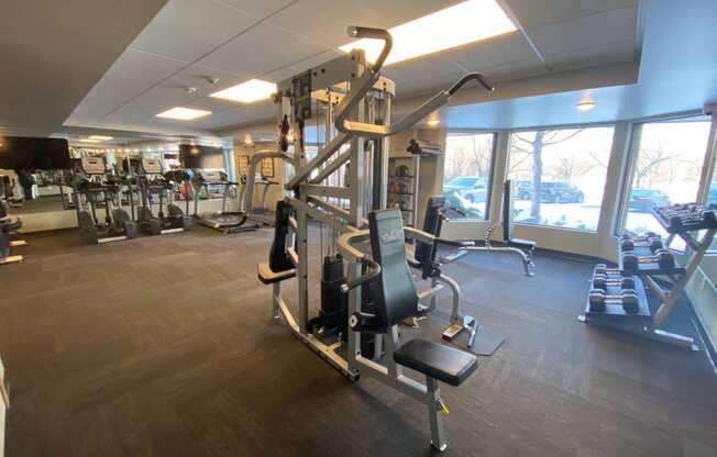 fitness center with weights and cardio machines at Aspenwood Apartments, 1125 Duckwood Trail, Eagan, MN 55123