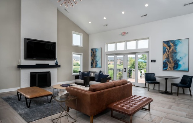 the estates at tanglewood|living room with fireplace and television