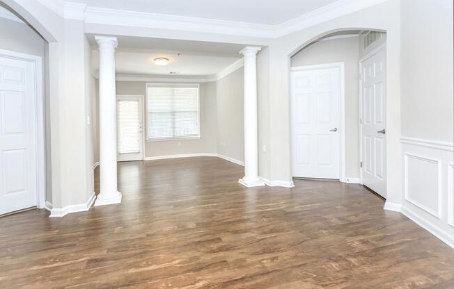 a room filled with furniture and a large window