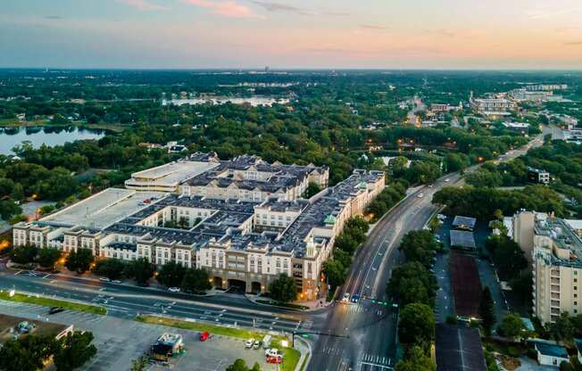 an aerial view of an office building next to a highway