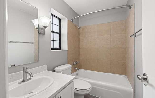 Large Soaking Tub In Master Bathroom With A Tile Surround at The Flats at Seminole Heights, Tampa, 33603