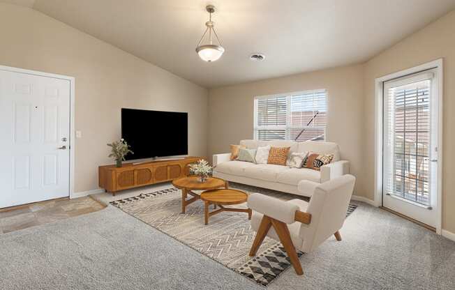 a living room with a couch and a tv