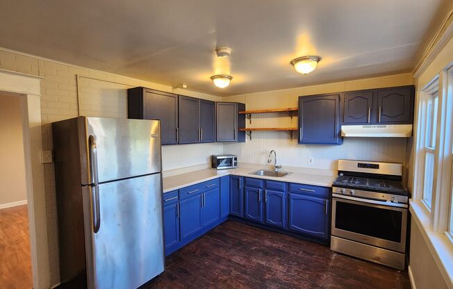 1st MONTH FREE*! Twin home with stainless appliances, washer & dryer in basement, central A/C, pets ok*!