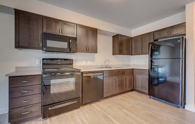 Kitchen with cabinets at VINTAGE AT MILL CREEK, Mill Creek, WA