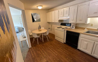 apartment kitchen with wood style flooring