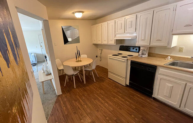 apartment kitchen with wood style flooring