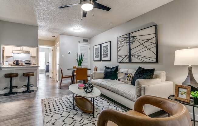 an open living room and kitchen with a couch and a table