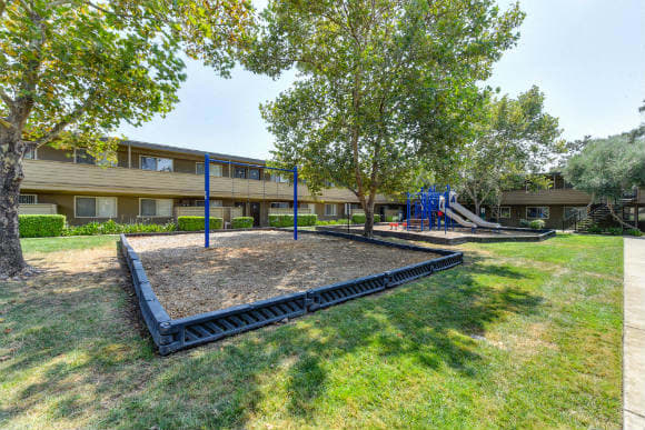  Community Outdoor Playground with Slides, Woodchip Floor and Grass