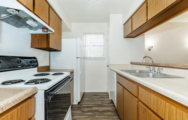 a kitchen with a stove and a sink