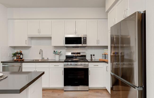 a kitchen with a sink and a microwave