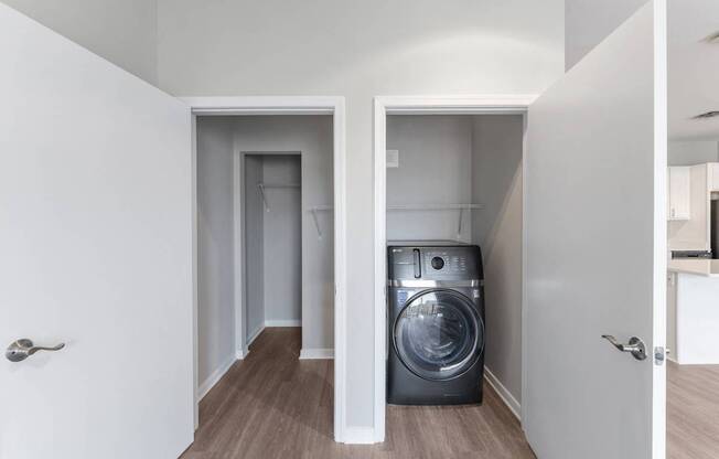 a washer and dryer in a small room in a house