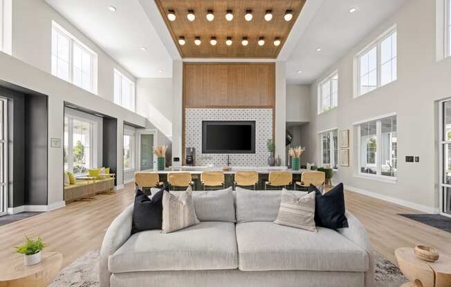 a large living room with a gray couch and a table with chairs at Palm Grove in Ellenton, FL 34222