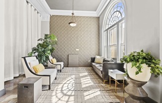 a living room filled with furniture and a large window