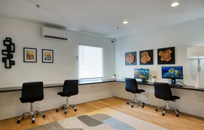an office with four chairs and a desk and a window at Presidio Palms Apartments, Tucson, AZ, 85701