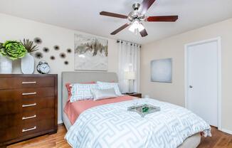 a bedroom with a bed in a room