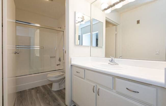 Bathroom with White Cabinets and Bathtub/Shower