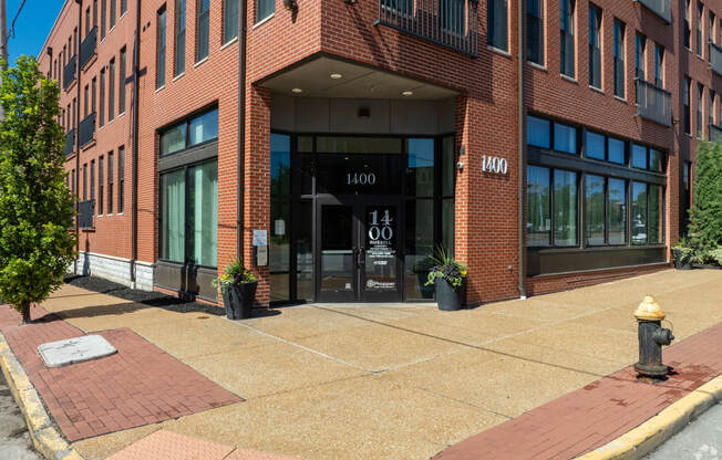 a brick building with a fire hydrant in front of it