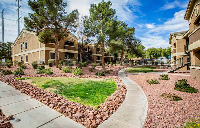 A residential area with houses and a curved pathway.