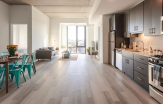 a kitchen and living room in an apartment