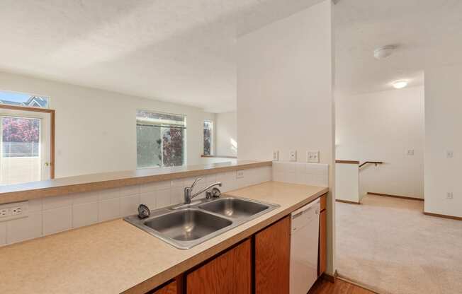 a kitchen with a sink and a dishwasher