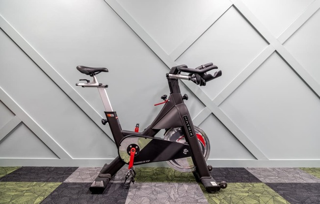 an exercise bike parked in a home gym at 310 at Nulu Apartments-Student, Louisville, KY