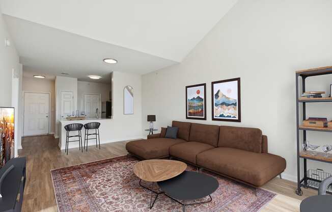 Spacious living room with wood-look flooring - Avenel at Montgomery Square