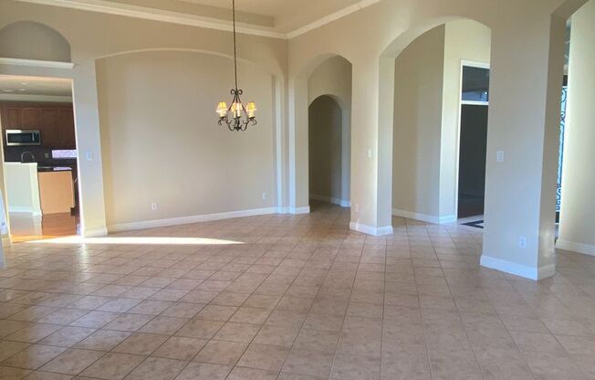 BEAUTIFUL CUSTOM ONE STORY HOME WITH WROUGHT IRON GATE COURTYARD ENTRY.