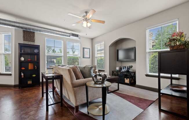 a living room with a couch and a tv