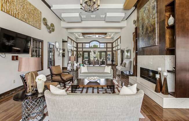 a living room with a couch and a table and a fireplace