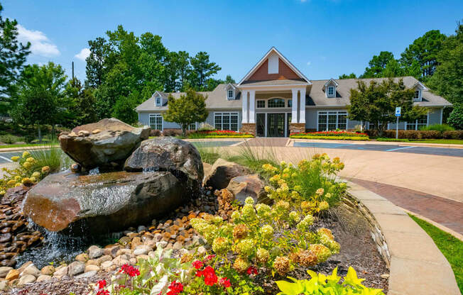 Lush landscaping surrounds you as you drive at Ashby at Ross Bridge, Hoover