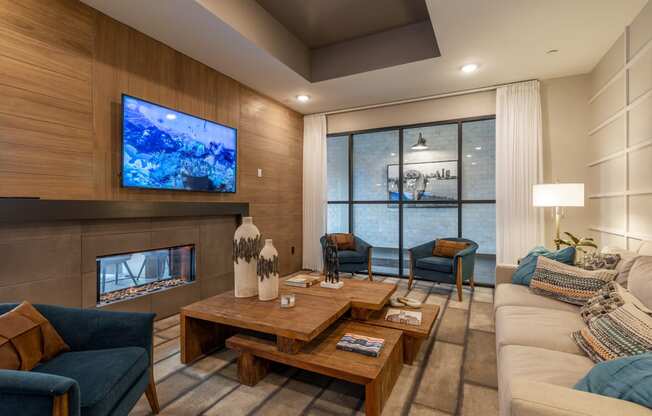 a living room with a couch and a table and a fireplace