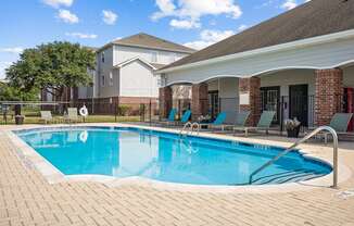 a swimming pool in front of a house