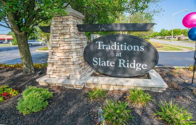 a sign that says traditions at slate ridge on the side of a street at Slate Ridge, Reynoldsburg, OH 43068