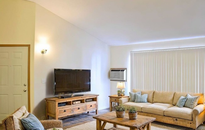 a living room with a couch and a television