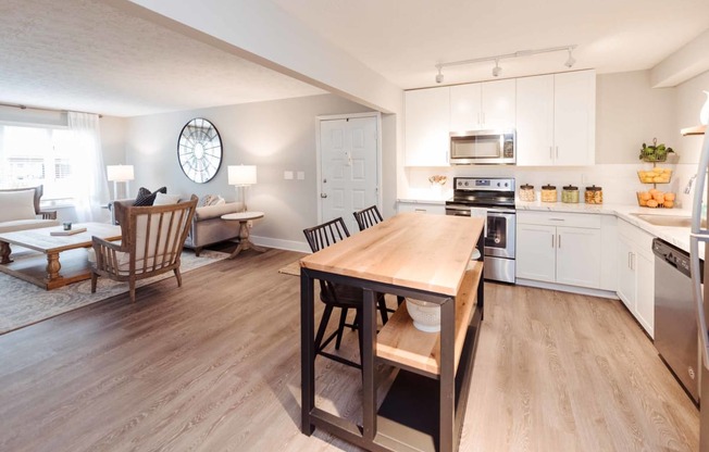 an open floor plan with a kitchen and living room