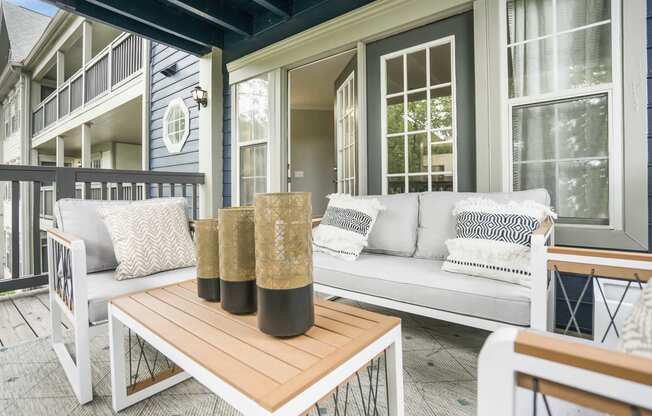 Outdoor balcony with seating and coffee table