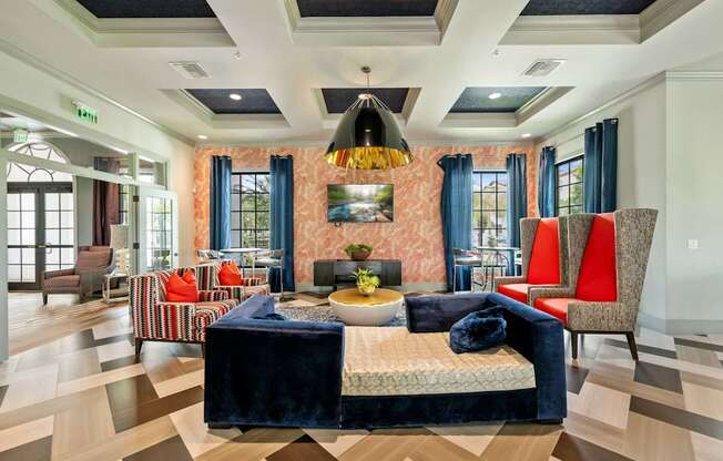 a living room with a checkered floor and a large table and chairs