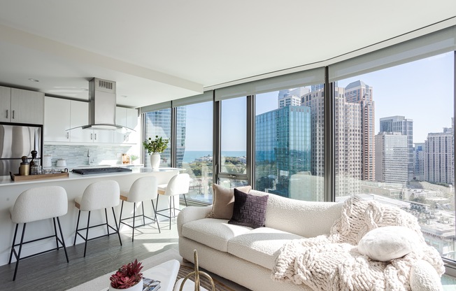 A modern living room with a view of the city skyline.