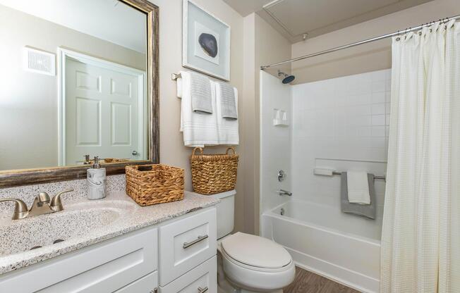 a room with a sink and a mirror