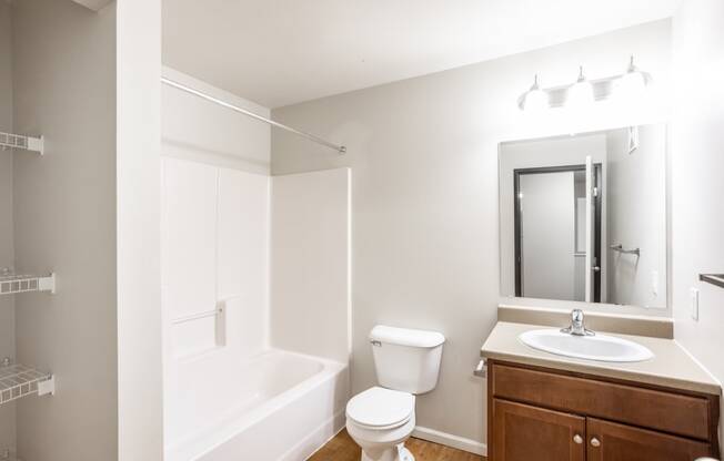 a bathroom with a sink toilet and a bath tub